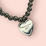 "NEVER LET GO" TITANIC PAVÉ HEART BRACELET